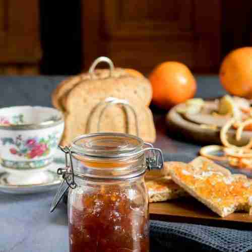 Ginger orange marmalade in jatr with toast