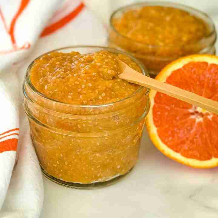orange marmalade with chia seeds in glass jar