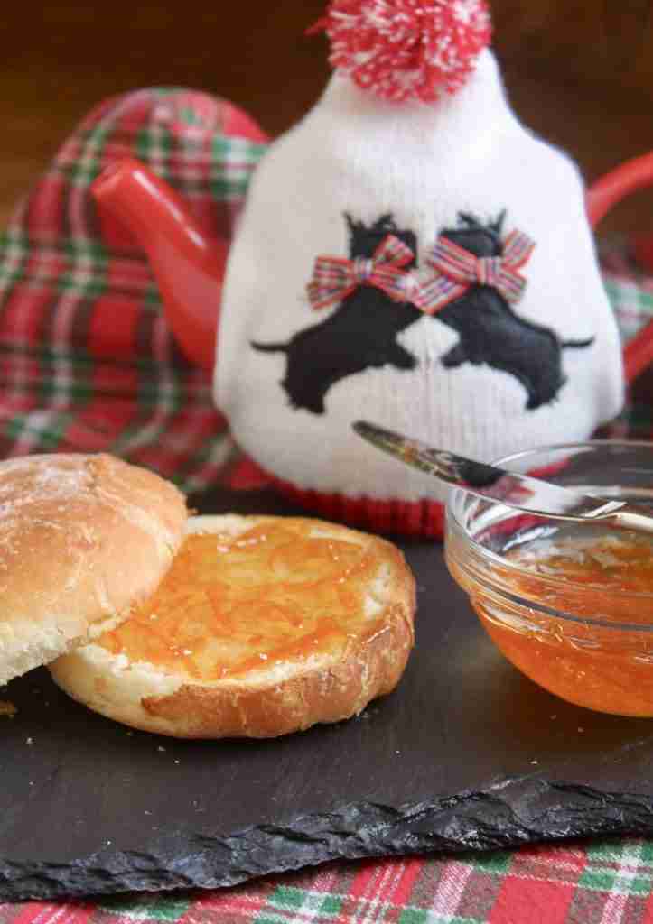 Scottish Drambuie marmalade in bowl with bread and teapot with Scottish terrier cosie