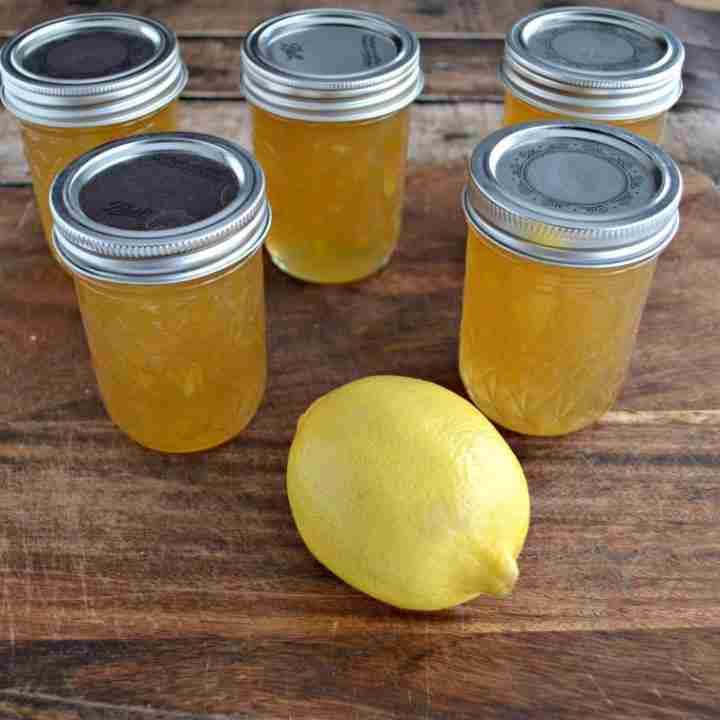 Lemon ginger marmalade in jars with fresh lemon