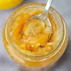 lemon marmalade in jar with spoom