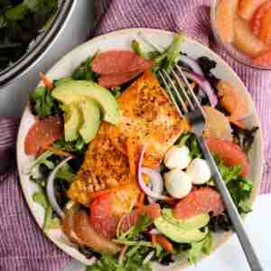 grapefruit salad with salmon in a bowl
