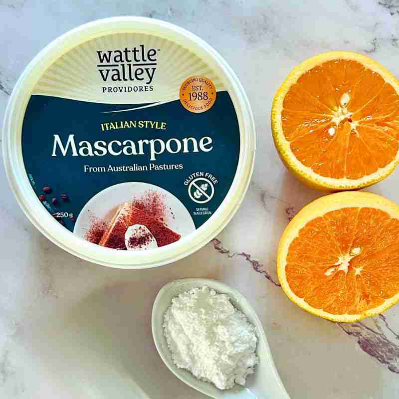 mascarpone cheese, orange halves and icing sugar