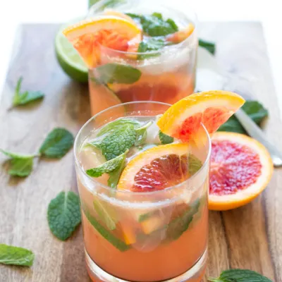 blood orange mojito cocktails in glass with mint