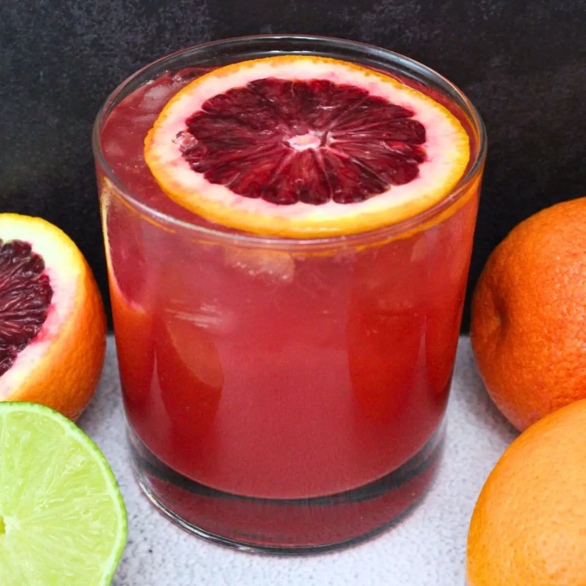 blood orange paloma cocktail with citrus fruits