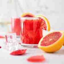 blood orange whiskey sour cocktail with frresh blood orange