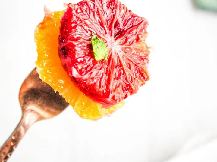blood orange salad with mint on fork