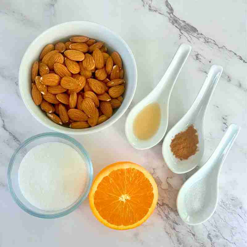 orange candied almond ingredients including natural almonds, sugar, orange, vanilla, cinnamon and salt